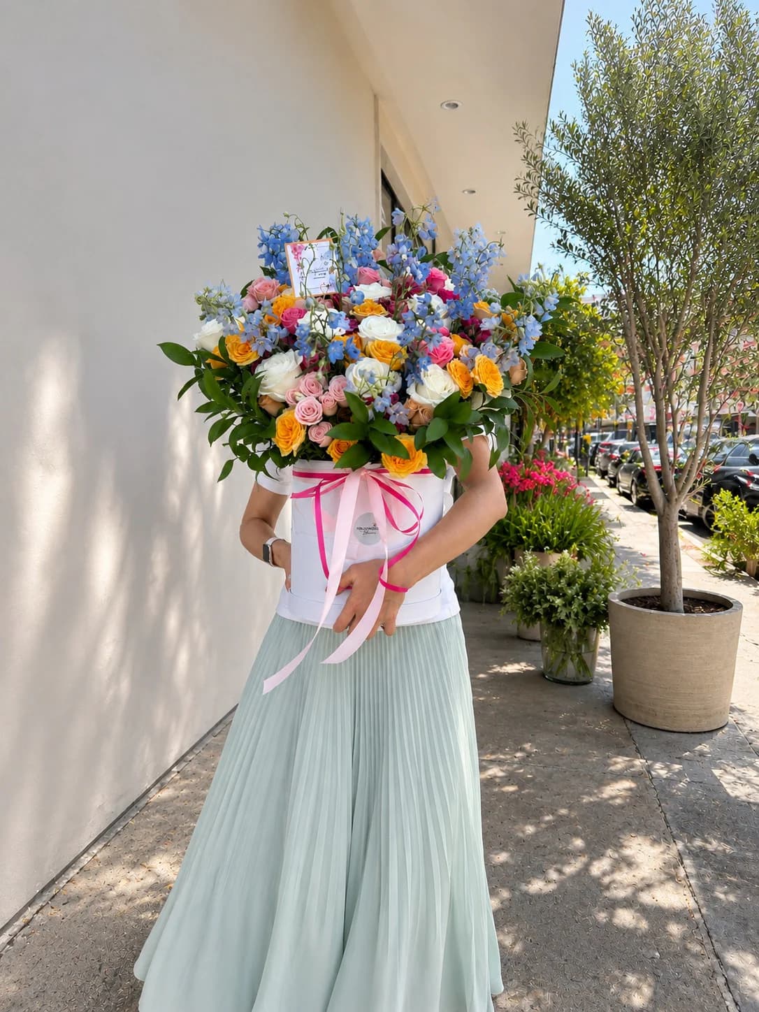 A large Hollywood Blooms arrangement carried along Sunset Boulevard
